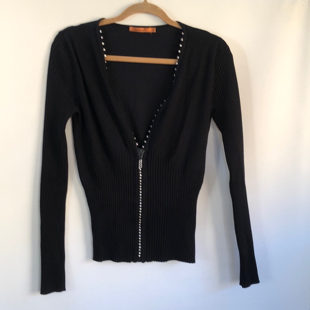 Black zip up sweater.